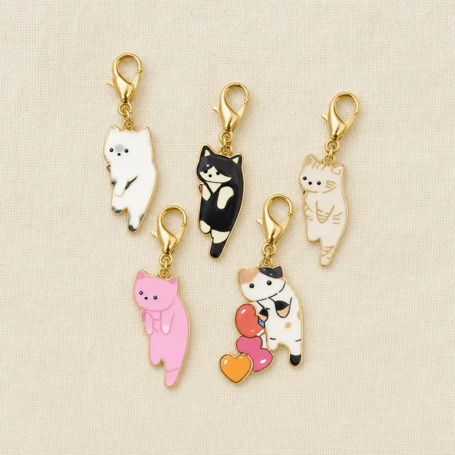 Enamel cat charm stitch markers on gold lobster clasps, set of five on a display card